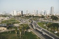 Aerial panoramic view of Tel Aviv. City buildings, well planned transport junction of highways, greenary, traffic and skysrapers Royalty Free Stock Photo