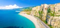 Aerial panoramic view of Tropea town and beach coastline of Tyrrhenian Sea with turquoise azure water, colorful houses Royalty Free Stock Photo