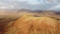 Aerial partial orbit from distance of Montana Roja Fuerteventura