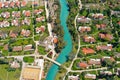 Aerial pass over Kibbutz Nir David with Amal river, Israel.