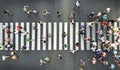 Aerial. People crowd motion on pedestrian crosswalk. Top view Royalty Free Stock Photo