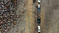 Aerial. People crowd and parking lot with cars. Top view Royalty Free Stock Photo