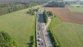 AERIAL: People driving their cars down highway get stuck in a traffic congestion