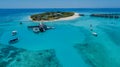 Aerial perspective of landscape tropical island luxury resort at the ocean with yachts in lagoon