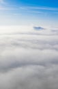 Aerial photo above the fog or white clouds with shining sun. Beautiful sunrise cloudy sky from aerial view. Above clouds Royalty Free Stock Photo