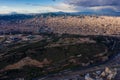Aerial photo of Barcelona panorama before storm. City with shadows from clouds. Moody weather. Montjuic Castle on the