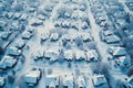 This aerial photo captures a snow-covered neighborhood in all its winter beauty, A neighborhood covered in fresh snow seen from Royalty Free Stock Photo