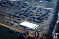 Aerial photo of cargo cranes, shipping containers and a warehouse