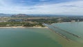 Aerial photo of Cha-am pier in  Phetchaburi Province, Thailand shows many fishing boats parked at the port, preparing to go to Royalty Free Stock Photo