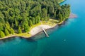 Aerial photo of Cultus Lake in Chilliwack, B.C. while people are enjoying the summer activities at the lakeshore and doing