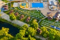 Aerial photo of a deserted recreation area with a pool and sun beds