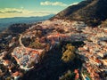 Aerial photo distant view charming Mijas pueblo, typical Andalusian white-washed mountain village Royalty Free Stock Photo