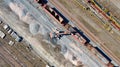 Aerial photo of an excavator loading a wagon with gravel