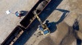 Aerial photo of an excavator loading a wagon with gravel