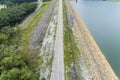 Aerial photo from flying drone of asphalt road and bicycle lane around the dam,beautiful nature landscape in phuket thailand