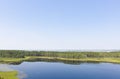 Aerial photo of forest boggy lake in the Karakansky pine forest near the shore of the Ob reservoir