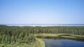 Aerial photo of forest boggy lake in the Karakansky pine forest near the shore of the Ob reservoir