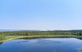 Aerial photo of forest boggy lake in the Karakansky pine forest near the shore of the Ob reservoir