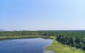 Aerial photo of forest boggy lake in the Karakansky pine forest near the shore of the Ob reservoir