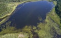 Aerial photo of forest boggy lake in the Karakansky pine forest near the shore of the Ob reservoir