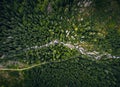 Aerial photo of green forest with curved mountain river by drone from very high altitude. Top view of peaceful forest in summer Royalty Free Stock Photo