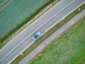 Aerial photo of grey car stopped on the road