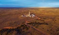 Aerial photo of hydraulic fracturing equipment at sunset. FRACKING