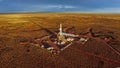 Aerial photo of hydraulic fracturing equipment at sunset. FRACKING