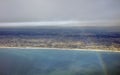 Aerial photo of the landscape and Japan coast around the Tokyo bay stretching all the way to the horizon during rainbow Royalty Free Stock Photo