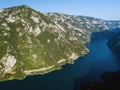 Aerial photo of a long winding road on Piva Lake in Montenegro