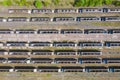 Aerial photo of a lot of hopper car / hopper wagon old rusty train cargo trucks on train tracks located in the town of York in Royalty Free Stock Photo