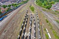 Aerial photo of a lot of hopper car / hopper wagon old rusty train cargo trucks on train tracks located in the town of York in