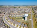 Aerial photo Manor Texas neighborhood homes with water tower community development Royalty Free Stock Photo