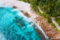 Aerial photo of ocean waves hitting rocky coastline of beautiful paradise dream tropical beach at Seychelles. Summer