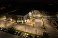 Aerial photo office building and parking lot at night
