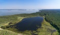 Aerial photo panorama of forest boggy lake in the Karakansky pine forest near the shore of the Ob reservoir Royalty Free Stock Photo