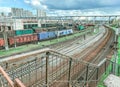 Aerial photo of railway terminal. Freight wagons with goods on railroad station. Cargo transportation. Import and export logistics Royalty Free Stock Photo