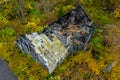 Aerial photo of the ruins of a burnt wooden house after fire