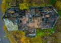 Aerial photo of the ruins of a burnt wooden house after fire