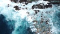 Aerial photo of strong and powerful ocean with huge waves. Rocks