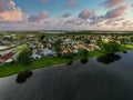 Aerial photo sunset neighborhood lake scene dramatic sky