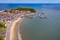 Aerial photo of the town centre of Scarborough in East Yorkshire in the UK showing the coastal beach and harbour with boats and Royalty Free Stock Photo