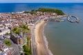 Aerial photo of the town centre of Scarborough in East Yorkshire in the UK showing the coastal beach and harbour with boats and Royalty Free Stock Photo