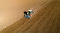 Tractor ploughing a field in the french countryside