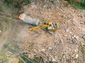 Drone photo of urban demolition site. excavator working in ruins