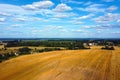Aerial photo. View of a yellow harvested field in the countryside