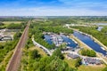 Aerial photo of a Water Treatment plant along side a boating harbour marina on a beautiful sunny summers day in the town of Royalty Free Stock Photo