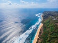 Aerial photo of a wild beach in Bali. The southern part of the island of Bali is the Bukit Peninsula. A long strip of beach and a Royalty Free Stock Photo