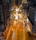 Aerial photo of a winding road leads to a large metropolitan cityscape of Wuhan night scene, China.