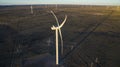Aerial photo of windmills powered by aerofoil that provide sustainable energy.